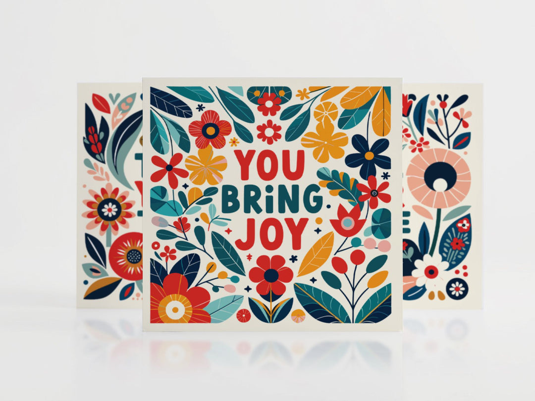 Benevolent Blooms 'You Bring Joy' greeting card with colorful folk art floral design featuring red, teal, and yellow blooms on cream background