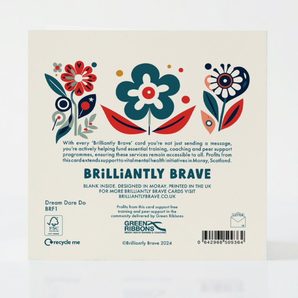 Back of the Dream Dare Do card detailing its eco-friendly FSC-certified design and the positive impact of supporting mental health services through every purchase.