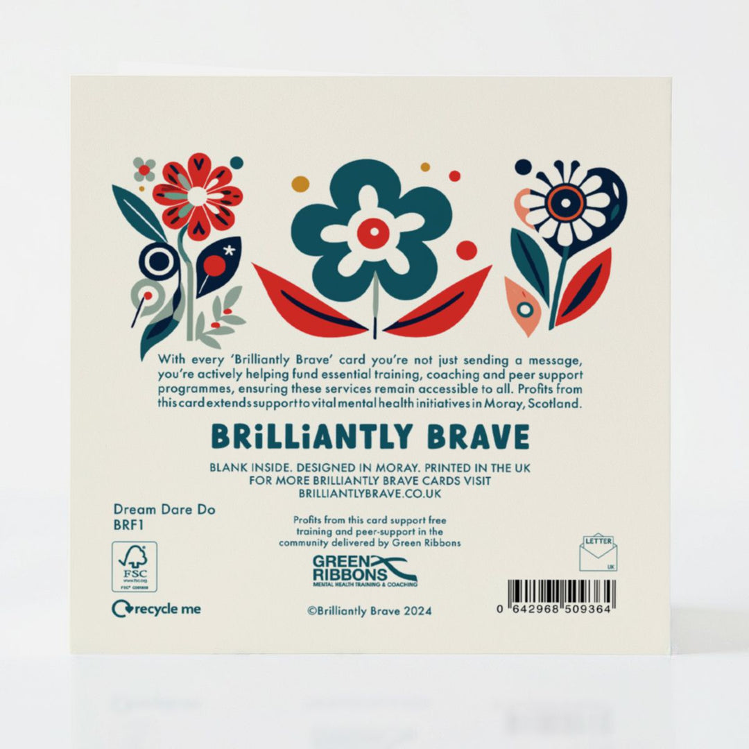 Back of the Dream Dare Do card detailing its eco-friendly FSC-certified design and the positive impact of supporting mental health services through every purchase.
