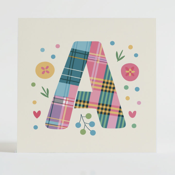 Mental health card featuring a bold A design with a tartan pattern and uplifting message.